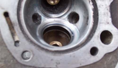 Showing the excess alloy and seat being skimmed away to improve gas-flow