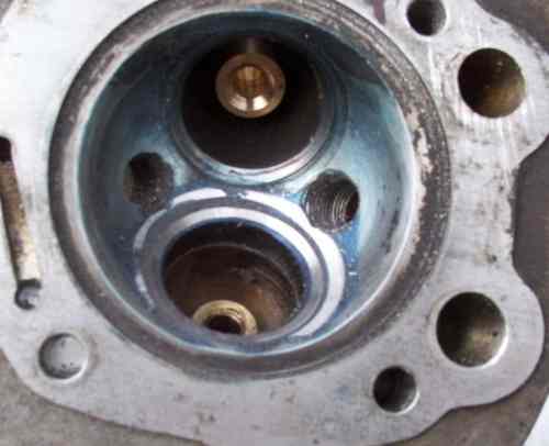 Showing the excess alloy and seat being skimmed away to improve gas-flow